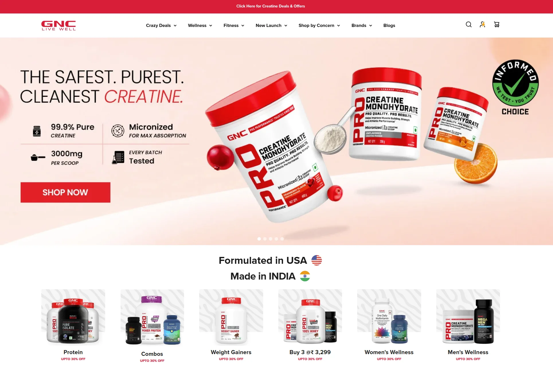 Screenshot of the GNC (Live Well) India brand webpage, designed to promote health and fitness supplements. At the top, a call-to-action banner reads 'Click Here for Creatine Deals & Offers'. The main navigation bar includes categories like Crazy Deals, Wellness, Fitness, New Launch, Shop by Concern, Brands, and Blogs. The hero section features a dedicated creatine product campaign with bold messaging emphasizing safety and purity: 'The Safest. Purest. Cleanest Creatine. Choice.' Key product claims include '99.9% Pure Creatine,' '3000mg per scoop,' 'Micronized for max absorption,' and 'Every Batch Tested.' A prominent 'Shop Now' button drives immediate action. The product is labeled 'Formulated in USA, Made in India.' Below the hero section, multiple promotional tiles display category-wide discounts, including up to 30% off on Protein, Combos, Weight Gainers, 'Buy 3 @ ₹3,299', Women's Wellness, and Men's Wellness. The overall visual tone is bold, athletic, and trustworthy, targeting fitness-conscious consumers looking for high-quality, lab-tested nutritional supplements.